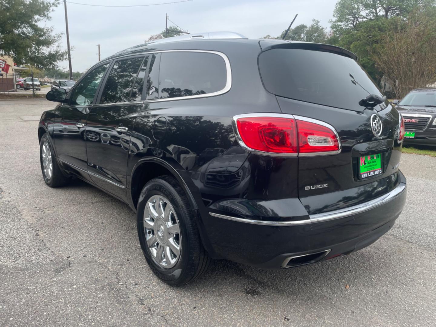 2014 BLACK BUICK ENCLAVE (5GAKRBKD4EJ) with an 3.6L engine, Automatic transmission, located at 5103 Dorchester Rd., Charleston, SC, 29418-5607, (843) 767-1122, 36.245171, -115.228050 - Leather interior with Navigation, Backup Camera, Bose Stereo with CD/AUX/Sat/Bluetooth, Dual Climate Control, Power Everything (windows, locks, seats, mirrors), Heated/Memory Seating, Rear Climate Control, Power Liftgate, 3rd Row with Middle Captains Row, Keyless Entry, Chrome Wheels. Clean CarFax ( - Photo#4