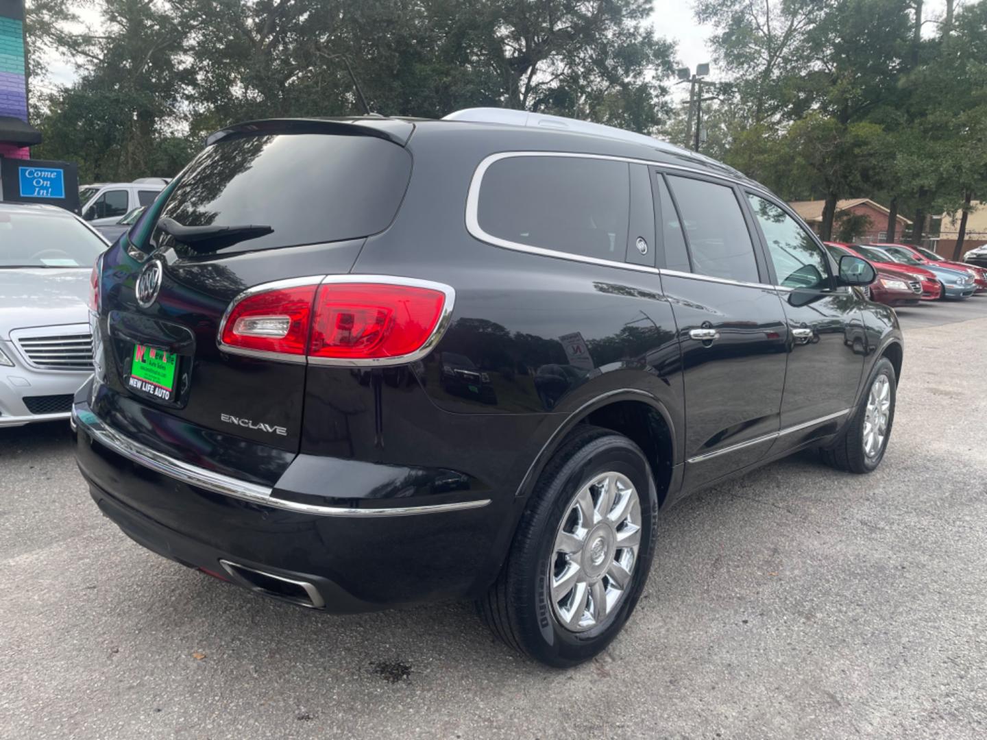 2014 BLACK BUICK ENCLAVE (5GAKRBKD4EJ) with an 3.6L engine, Automatic transmission, located at 5103 Dorchester Rd., Charleston, SC, 29418-5607, (843) 767-1122, 36.245171, -115.228050 - Leather interior with Navigation, Backup Camera, Bose Stereo with CD/AUX/Sat/Bluetooth, Dual Climate Control, Power Everything (windows, locks, seats, mirrors), Heated/Memory Seating, Rear Climate Control, Power Liftgate, 3rd Row with Middle Captains Row, Keyless Entry, Chrome Wheels. Clean CarFax ( - Photo#6