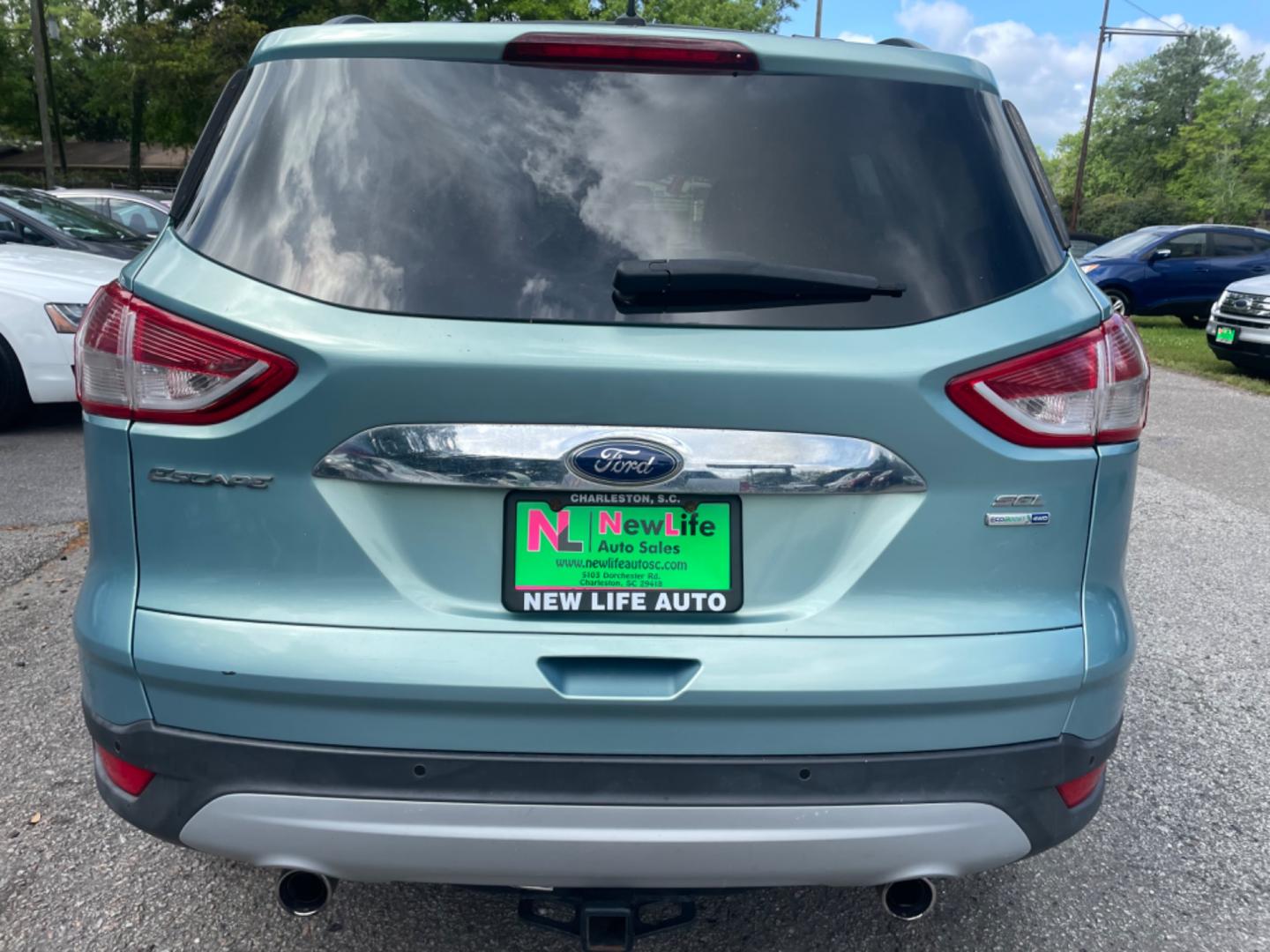 2013 BLUE FORD ESCAPE SEL (1FMCU9HX0DU) with an 1.6L engine, Automatic transmission, located at 5103 Dorchester Rd., Charleston, SC, 29418-5607, (843) 767-1122, 36.245171, -115.228050 - Clean CarFax (no accidents reported!) Clean interior with Leather, CD/USB/Sat/Bluetooth, Power Everything (windows, locks, seat, mirrors), Power Liftgate, Heated/Memory Seating, Push Button Start, Keyless Entry, Alloy Wheels. Certified One Owner!! Only 109k miles! Located at New Life Auto Sales! 2 - Photo#3