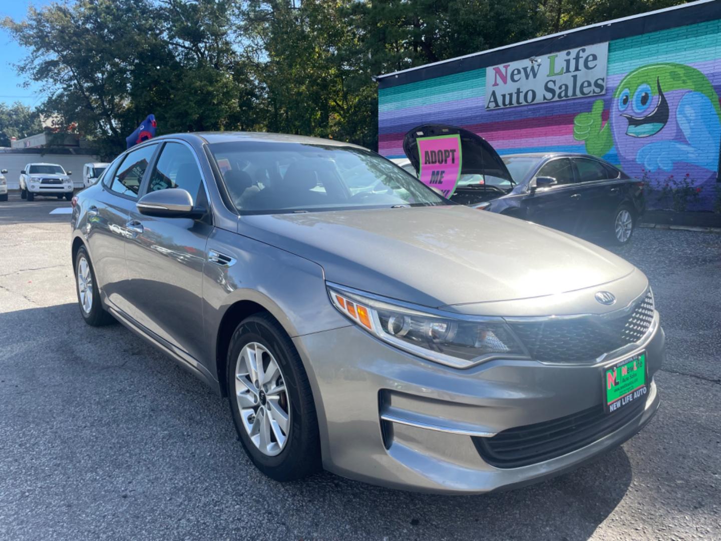 2016 GRAY KIA OPTIMA LX (5XXGT4L32GG) with an 2.4L engine, Automatic transmission, located at 5103 Dorchester Rd., Charleston, SC, 29418-5607, (843) 767-1122, 36.245171, -115.228050 - Photo#0