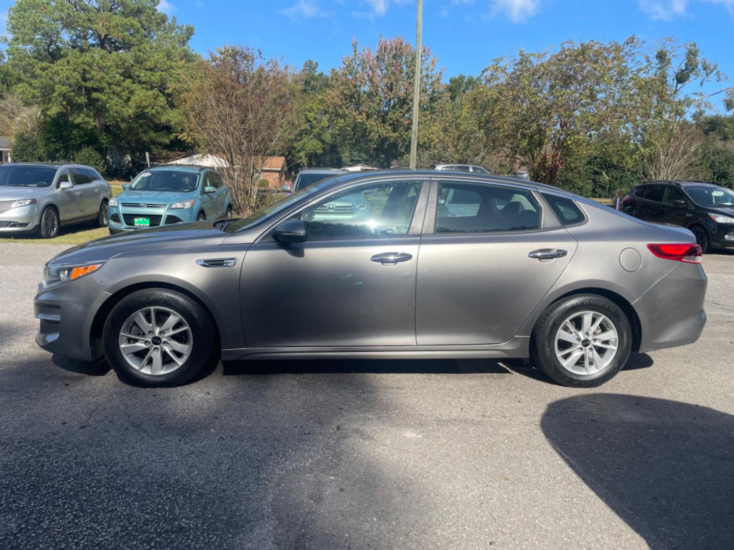 2016 GRAY KIA OPTIMA LX (5XXGT4L32GG) with an 2.4L engine, Automatic transmission, located at 5103 Dorchester Rd., Charleston, SC, 29418-5607, (843) 767-1122, 36.245171, -115.228050 - Photo#3