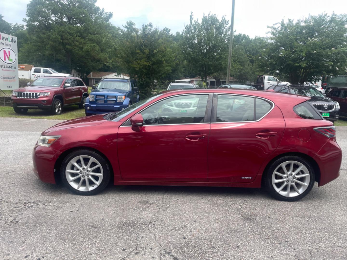 2013 RED LEXUS CT 200 (JTHKD5BH3D2) with an 1.8L engine, Automatic transmission, located at 5103 Dorchester Rd., Charleston, SC, 29418-5607, (843) 767-1122, 36.245171, -115.228050 - Local Trade-in with Leather, Sunroof, CD/AUX/Sat/Bluetooth, Navigation, Backup Camera, Dual Climate Control, Power Everything (locks, seats, mirrors), Heated Seats, Push Button Start, Keyless Entry, Alloy Wheels. Only 106k miles! Located at New Life Auto Sales! 2023 WINNER for Post & Courier's Char - Photo#2