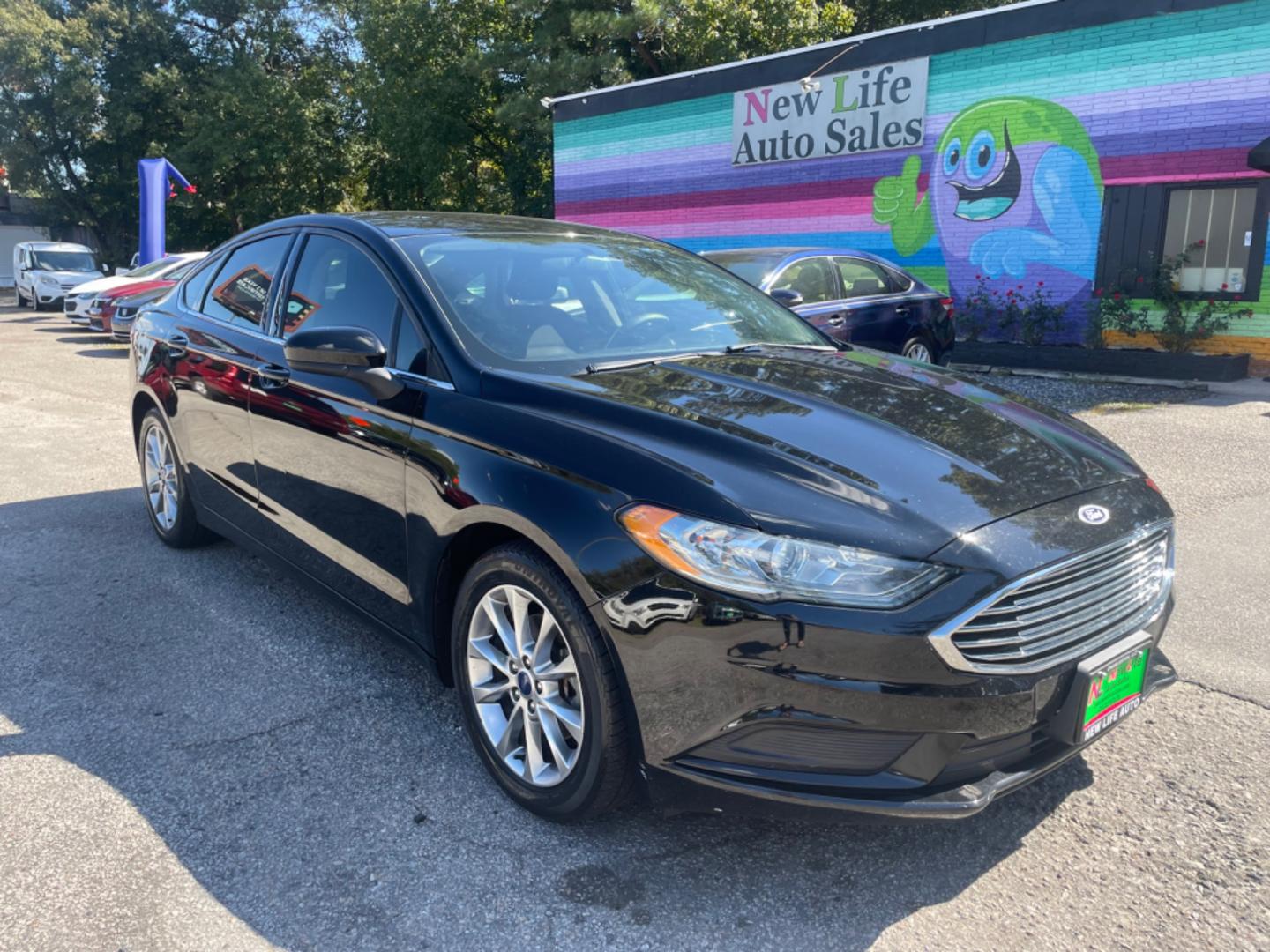 2017 BLACK FORD FUSION SE (3FA6P0H79HR) with an 2.5L engine, Automatic transmission, located at 5103 Dorchester Rd., Charleston, SC, 29418-5607, (843) 767-1122, 36.245171, -115.228050 - Comfortable interior with CD/AUX/Sat/Bluetooth, Backup Camera, Power Everything (windows, locks, seats, mirrors), Push Button Start, Keyless Entry, Alloy Wheels. Clean CarFax (no accidents reported!) Local Trade-in!! Only 92k miles Located at New Life Auto Sales! 2023 WINNER for Post & Courier's C - Photo#0