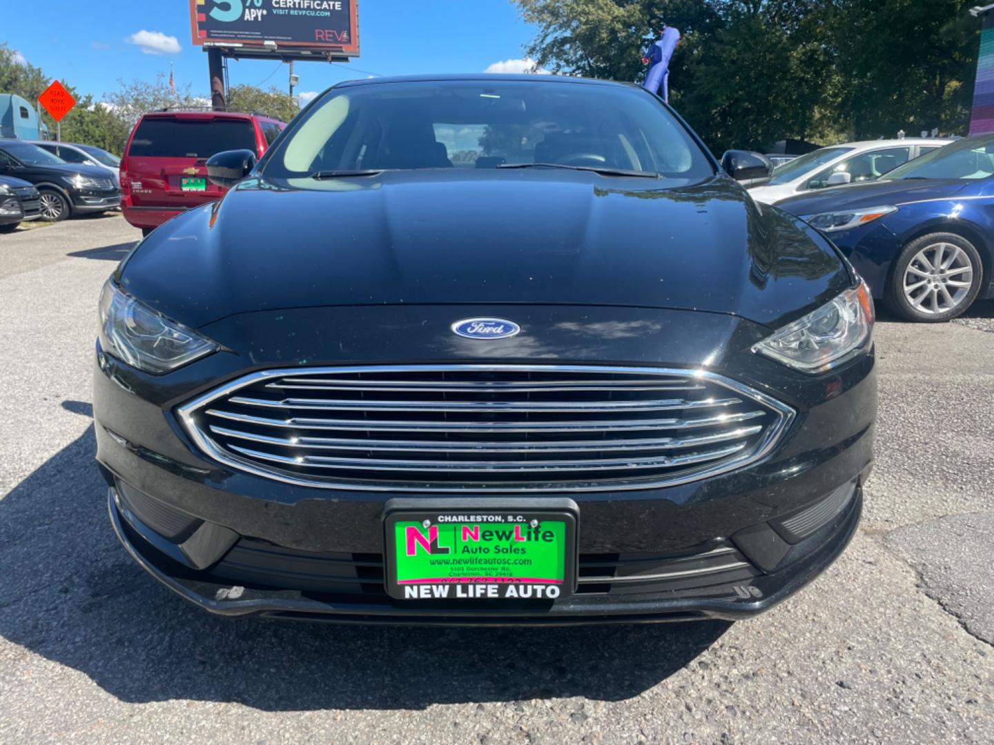 2017 BLACK FORD FUSION SE (3FA6P0H79HR) with an 2.5L engine, Automatic transmission, located at 5103 Dorchester Rd., Charleston, SC, 29418-5607, (843) 767-1122, 36.245171, -115.228050 - Comfortable interior with CD/AUX/Sat/Bluetooth, Backup Camera, Power Everything (windows, locks, seats, mirrors), Push Button Start, Keyless Entry, Alloy Wheels. Clean CarFax (no accidents reported!) Local Trade-in!! Only 92k miles Located at New Life Auto Sales! 2023 WINNER for Post & Courier's C - Photo#1