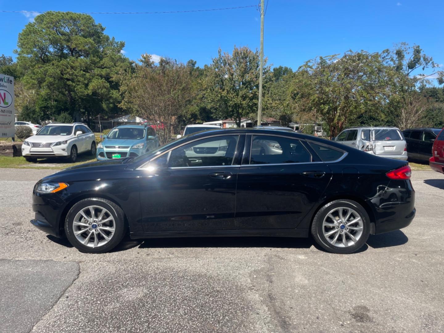 2017 BLACK FORD FUSION SE (3FA6P0H79HR) with an 2.5L engine, Automatic transmission, located at 5103 Dorchester Rd., Charleston, SC, 29418-5607, (843) 767-1122, 36.245171, -115.228050 - Comfortable interior with CD/AUX/Sat/Bluetooth, Backup Camera, Power Everything (windows, locks, seats, mirrors), Push Button Start, Keyless Entry, Alloy Wheels. Clean CarFax (no accidents reported!) Local Trade-in!! Only 92k miles Located at New Life Auto Sales! 2023 WINNER for Post & Courier's C - Photo#3