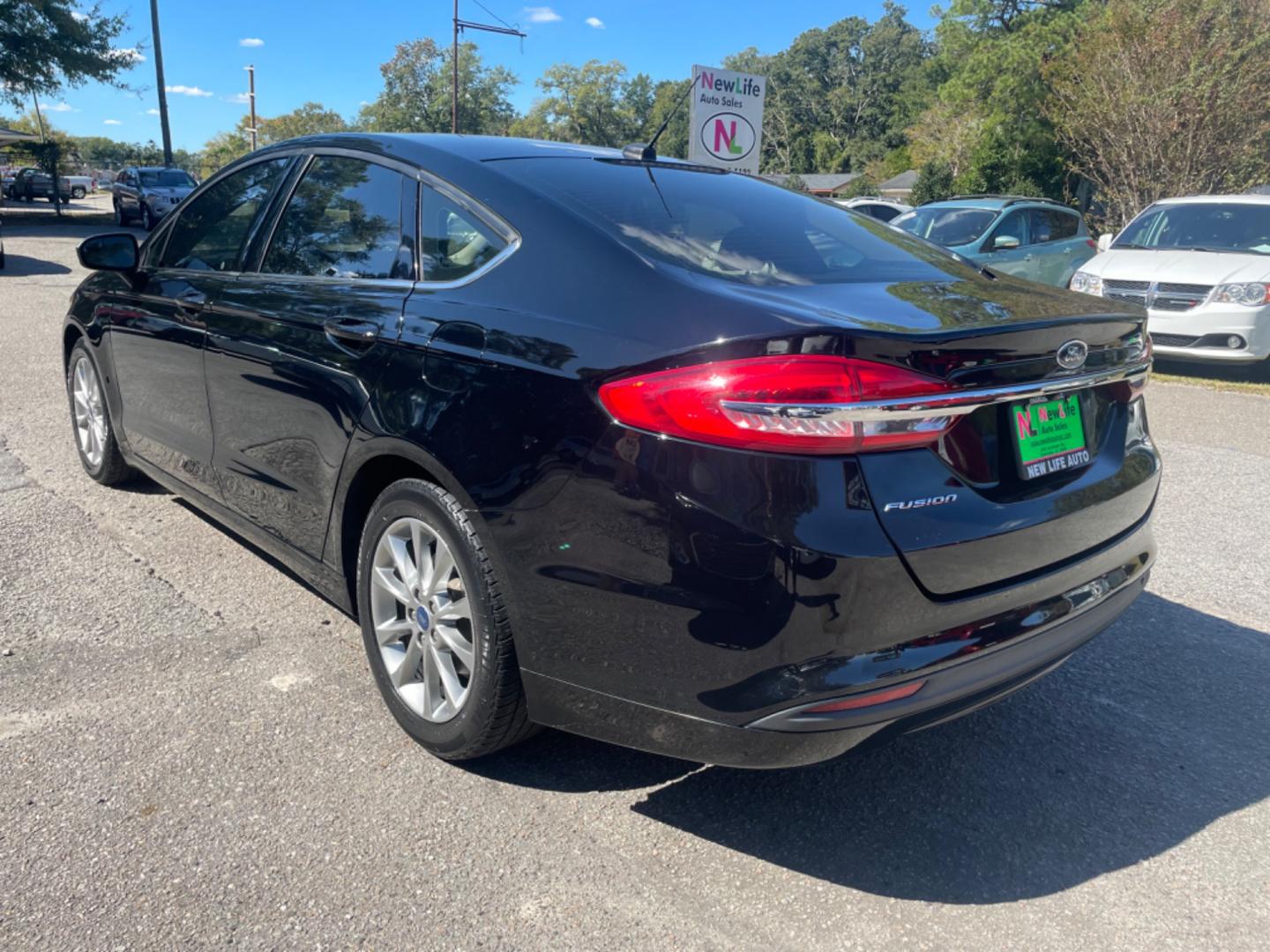 2017 BLACK FORD FUSION SE (3FA6P0H79HR) with an 2.5L engine, Automatic transmission, located at 5103 Dorchester Rd., Charleston, SC, 29418-5607, (843) 767-1122, 36.245171, -115.228050 - Comfortable interior with CD/AUX/Sat/Bluetooth, Backup Camera, Power Everything (windows, locks, seats, mirrors), Push Button Start, Keyless Entry, Alloy Wheels. Clean CarFax (no accidents reported!) Local Trade-in!! Only 92k miles Located at New Life Auto Sales! 2023 WINNER for Post & Courier's C - Photo#4