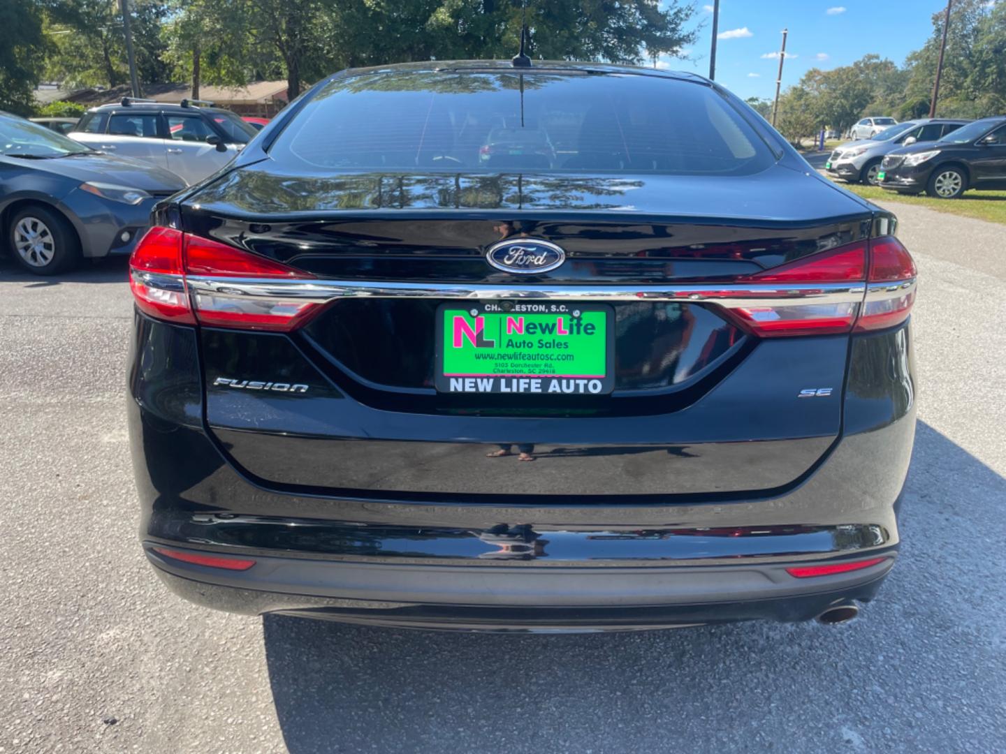 2017 BLACK FORD FUSION SE (3FA6P0H79HR) with an 2.5L engine, Automatic transmission, located at 5103 Dorchester Rd., Charleston, SC, 29418-5607, (843) 767-1122, 36.245171, -115.228050 - Comfortable interior with CD/AUX/Sat/Bluetooth, Backup Camera, Power Everything (windows, locks, seats, mirrors), Push Button Start, Keyless Entry, Alloy Wheels. Clean CarFax (no accidents reported!) Local Trade-in!! Only 92k miles Located at New Life Auto Sales! 2023 WINNER for Post & Courier's C - Photo#5