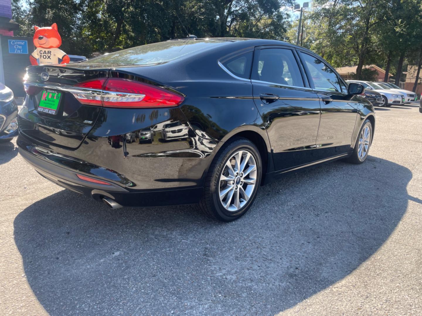 2017 BLACK FORD FUSION SE (3FA6P0H79HR) with an 2.5L engine, Automatic transmission, located at 5103 Dorchester Rd., Charleston, SC, 29418-5607, (843) 767-1122, 36.245171, -115.228050 - Comfortable interior with CD/AUX/Sat/Bluetooth, Backup Camera, Power Everything (windows, locks, seats, mirrors), Push Button Start, Keyless Entry, Alloy Wheels. Clean CarFax (no accidents reported!) Local Trade-in!! Only 92k miles Located at New Life Auto Sales! 2023 WINNER for Post & Courier's C - Photo#6