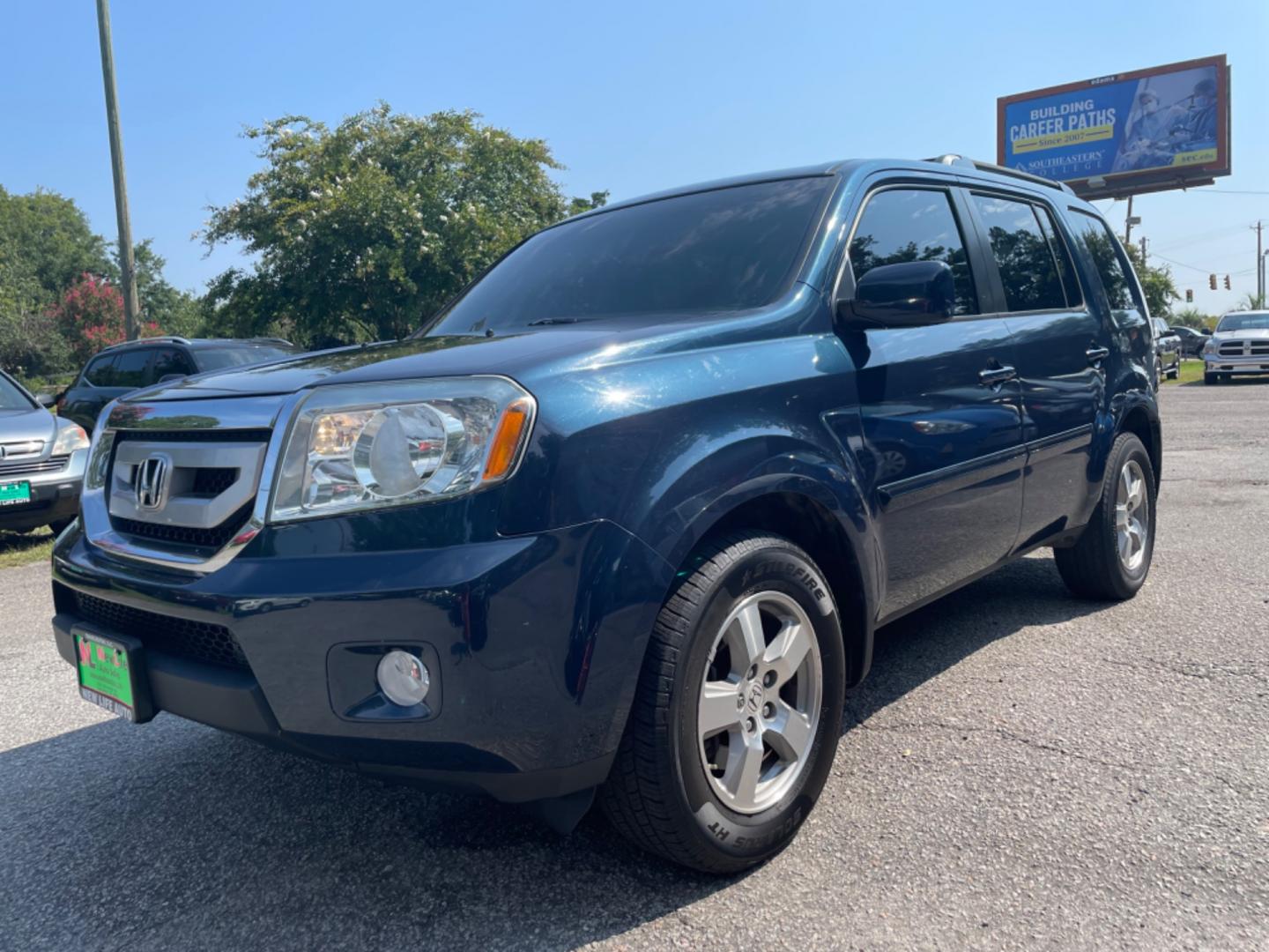 2011 BLUE HONDA PILOT EX-L W/DVD (5FNYF3H66BB) with an 3.5L engine, Automatic transmission, located at 5103 Dorchester Rd., Charleston, SC, 29418-5607, (843) 767-1122, 36.245171, -115.228050 - Local Trade-in with Leather, Sunroof, Backup Camera, 6-disc CD/Sat/AUX, Dual Climate Control, Power Everything (windows, locks, seats, mirrors), Heated Seats, Rear DVD, Rear Climate, Keyless Entry, Alloy Wheels. Clean CarFax (no accidents reported!) 130k miles Located at New Life Auto Sales! 2023 W - Photo#2