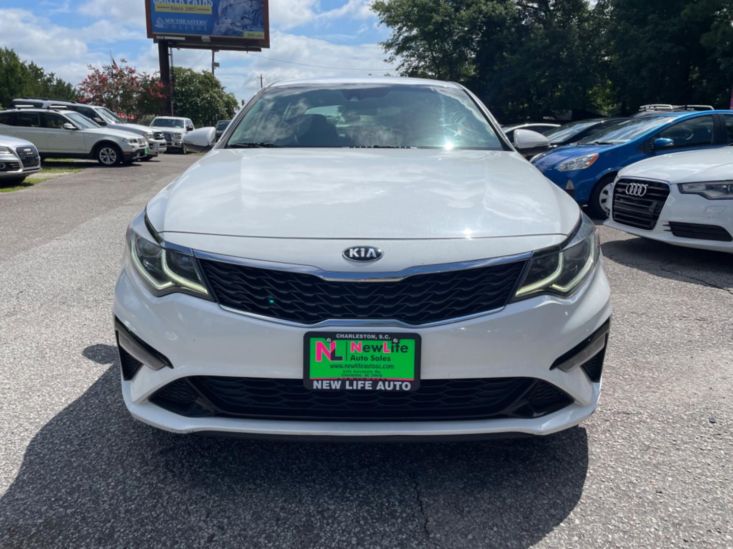 2019 WHITE KIA OPTIMA LX (5XXGT4L34KG) with an 2.4L engine, Automatic transmission, located at 5103 Dorchester Rd., Charleston, SC, 29418-5607, (843) 767-1122, 36.245171, -115.228050 - Spacious interior with AUX/USB/Bluetooth, Apply CarPlay/Android Auto, Backup Camera, Power Windows, Power Locks, Power Mirrors, Keyless Entry, Alloy Wheels. Clean CarFax (no accidents reported!) Local Trade-in! 136k miles Located at New Life Auto Sales! 2023 WINNER for Post & Courier's Charleston's - Photo#1