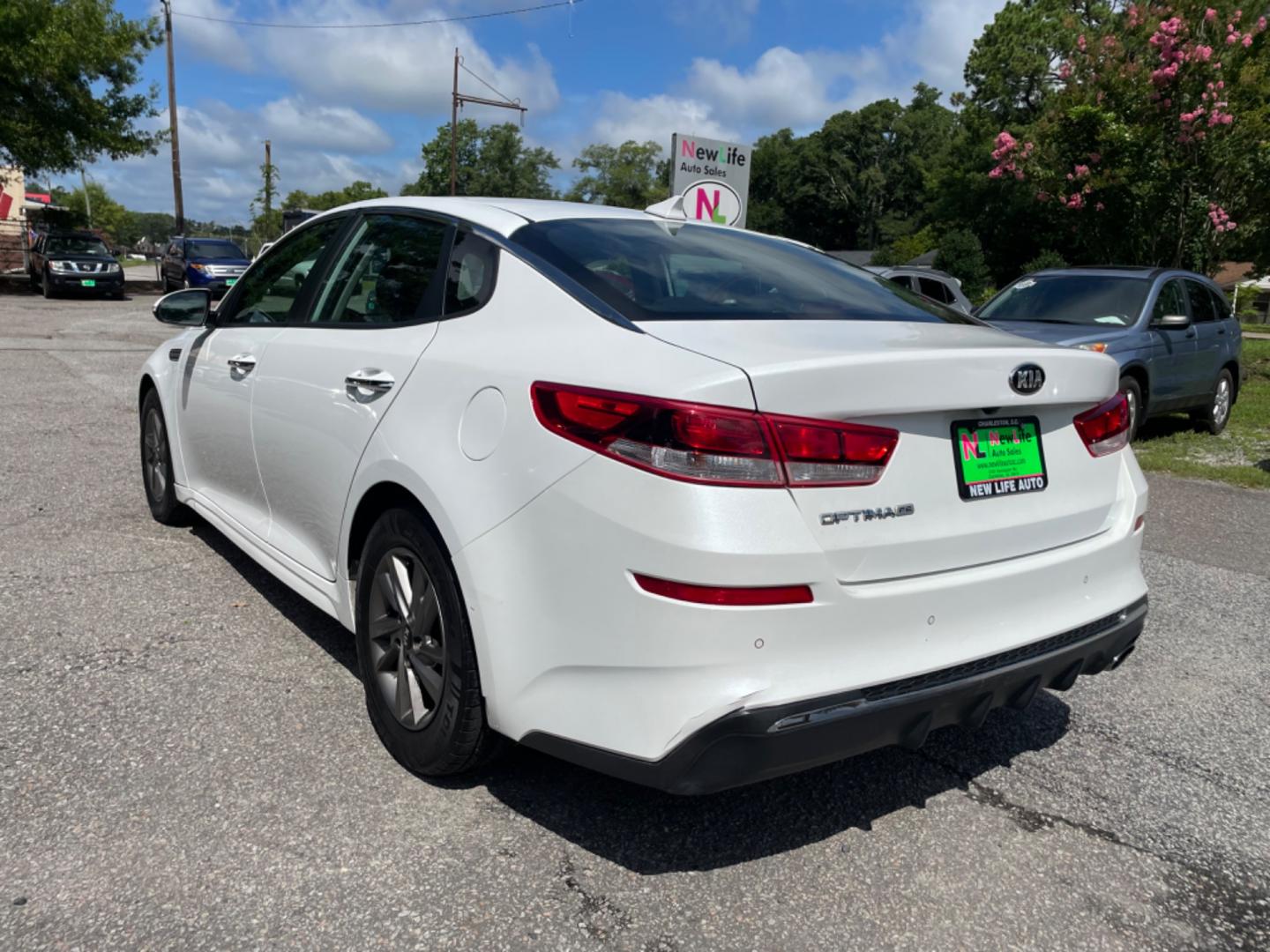 2019 WHITE KIA OPTIMA LX (5XXGT4L34KG) with an 2.4L engine, Automatic transmission, located at 5103 Dorchester Rd., Charleston, SC, 29418-5607, (843) 767-1122, 36.245171, -115.228050 - Spacious interior with AUX/USB/Bluetooth, Apply CarPlay/Android Auto, Backup Camera, Power Windows, Power Locks, Power Mirrors, Keyless Entry, Alloy Wheels. Clean CarFax (no accidents reported!) Local Trade-in! 136k miles Located at New Life Auto Sales! 2023 WINNER for Post & Courier's Charleston's - Photo#4