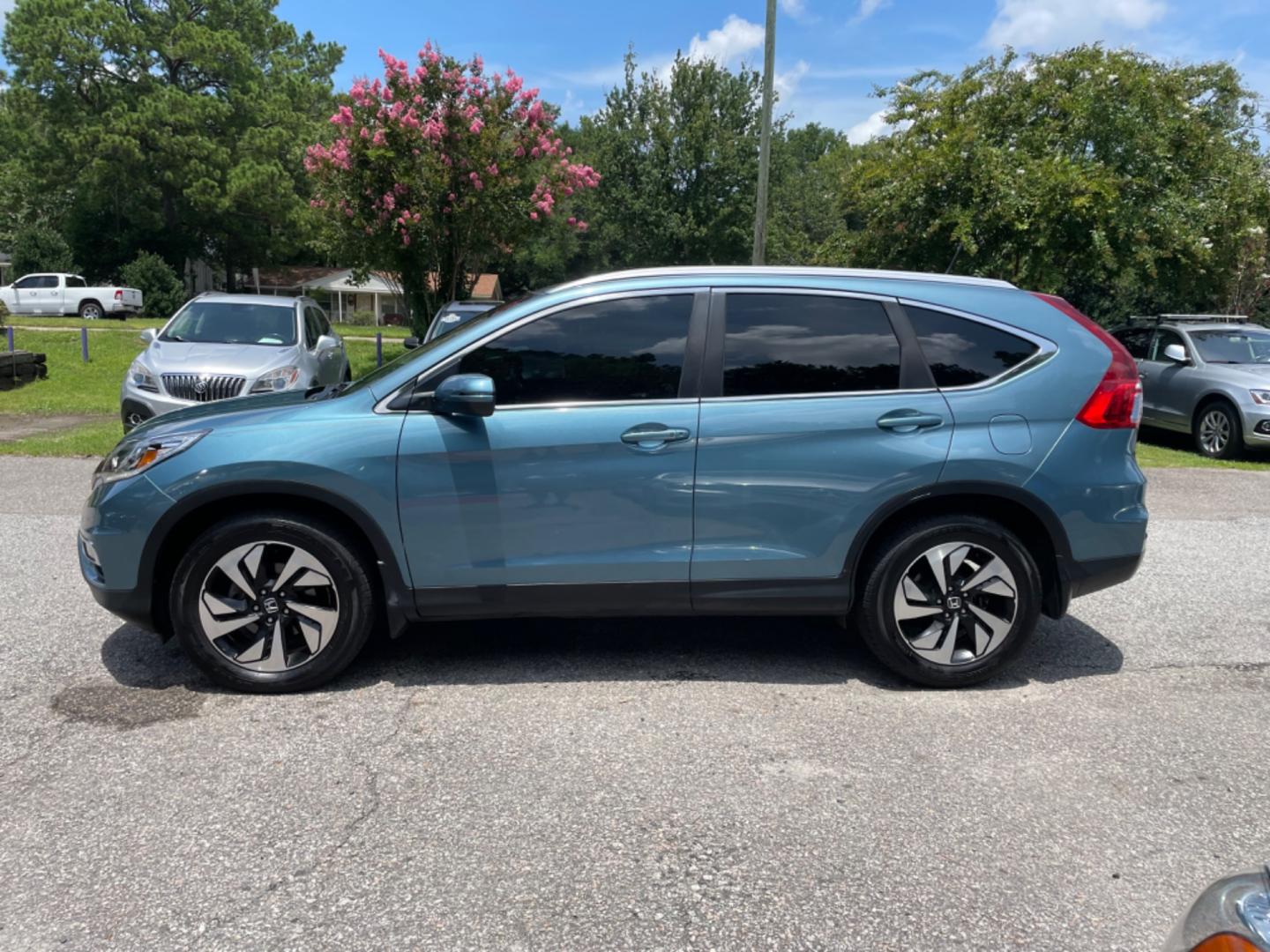 2015 BLUE HONDA CR-V TOURING (5J6RM3H90FL) with an 2.4L engine, Continuously Variable transmission, located at 5103 Dorchester Rd., Charleston, SC, 29418-5607, (843) 767-1122, 36.245171, -115.228050 - Clean Interior with Leather, Sunroof, Navigation, Backup Camera, AUX/USB/Sat/Bluetooth, Dual Climate Control, Lane Departure Assist, Power Everything (windows, locks, seats, mirrors), Power Liftgate, Heated/Memory Seats, Keyless Entry, Alloy Wheels. Local Trade-in! 167k miles Located at New Life Au - Photo#3