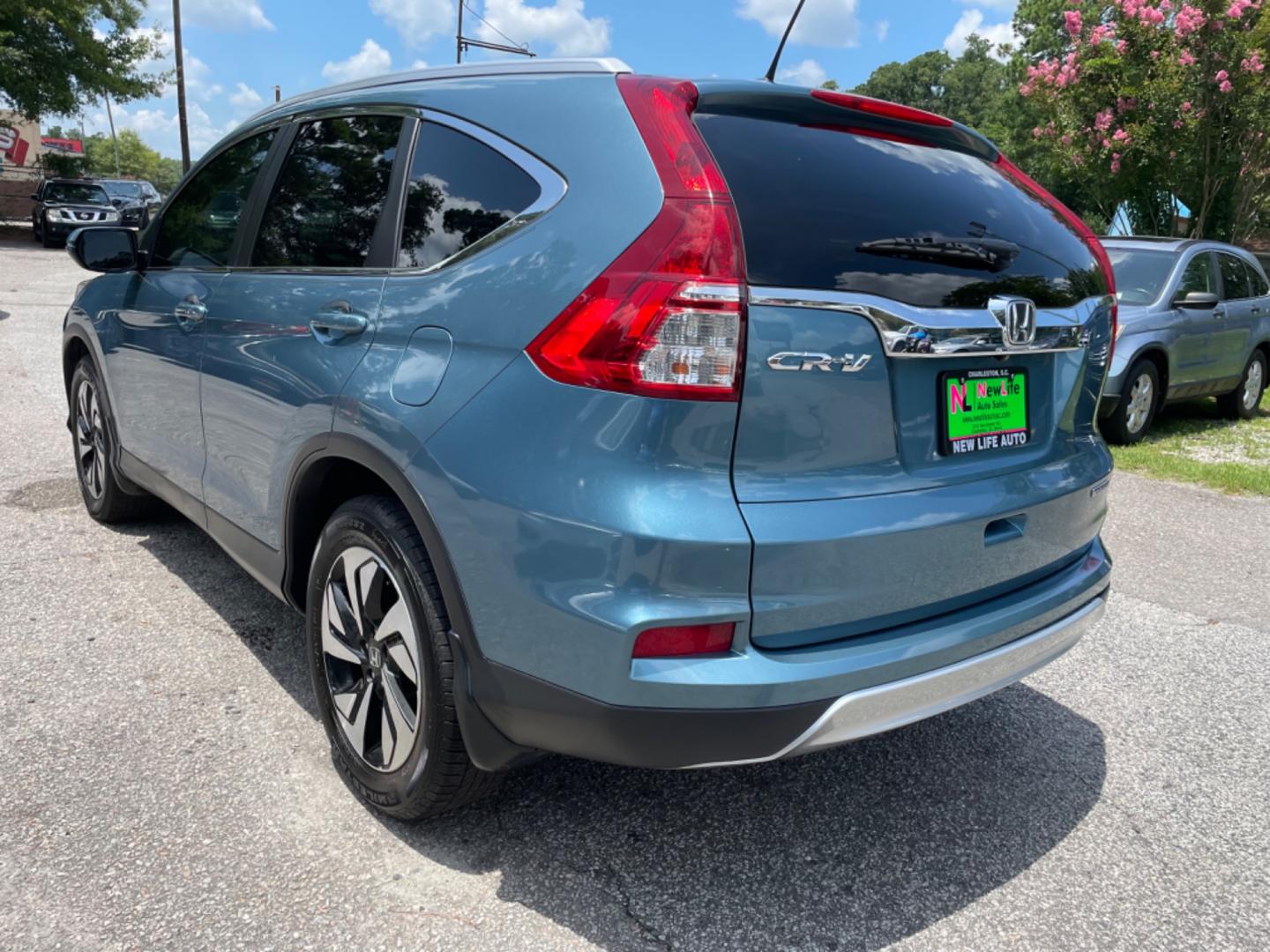 2015 BLUE HONDA CR-V TOURING (5J6RM3H90FL) with an 2.4L engine, Continuously Variable transmission, located at 5103 Dorchester Rd., Charleston, SC, 29418-5607, (843) 767-1122, 36.245171, -115.228050 - Clean Interior with Leather, Sunroof, Navigation, Backup Camera, AUX/USB/Sat/Bluetooth, Dual Climate Control, Lane Departure Assist, Power Everything (windows, locks, seats, mirrors), Power Liftgate, Heated/Memory Seats, Keyless Entry, Alloy Wheels. Local Trade-in! 167k miles Located at New Life Au - Photo#4