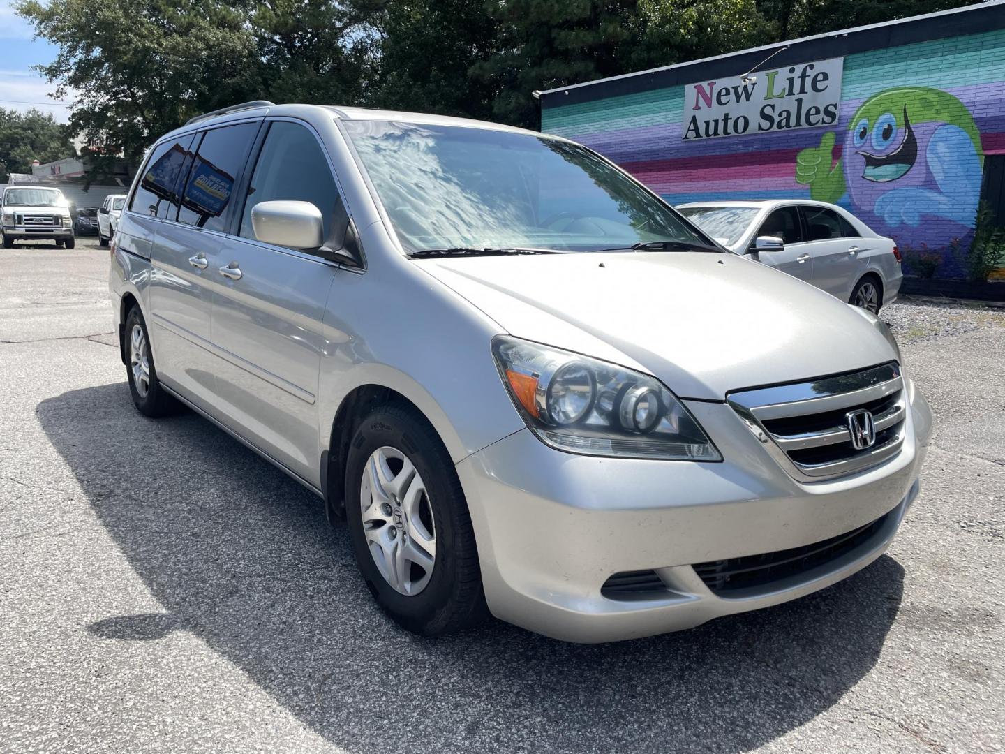 2007 SILVER HONDA ODYSSEY EX-L W/DVD (5FNRL38737B) with an 3.5L engine, Automatic transmission, located at 5103 Dorchester Rd., Charleston, SC, 29418-5607, (843) 767-1122, 36.245171, -115.228050 - Leather, Sunroof, 6-Disc CD/Aux/Sat, Dual Climate Control, Power Everything (windows, locks, seat, mirrors), Heated Seats, Power Sliding Doors, Rear Climate Control, Rear DVD, Keyless Entry, Alloy Wheels. Local Trade-in!! 157k miles Located at New Life Auto Sales! 2023 WINNER for Post & Courier's C - Photo#0