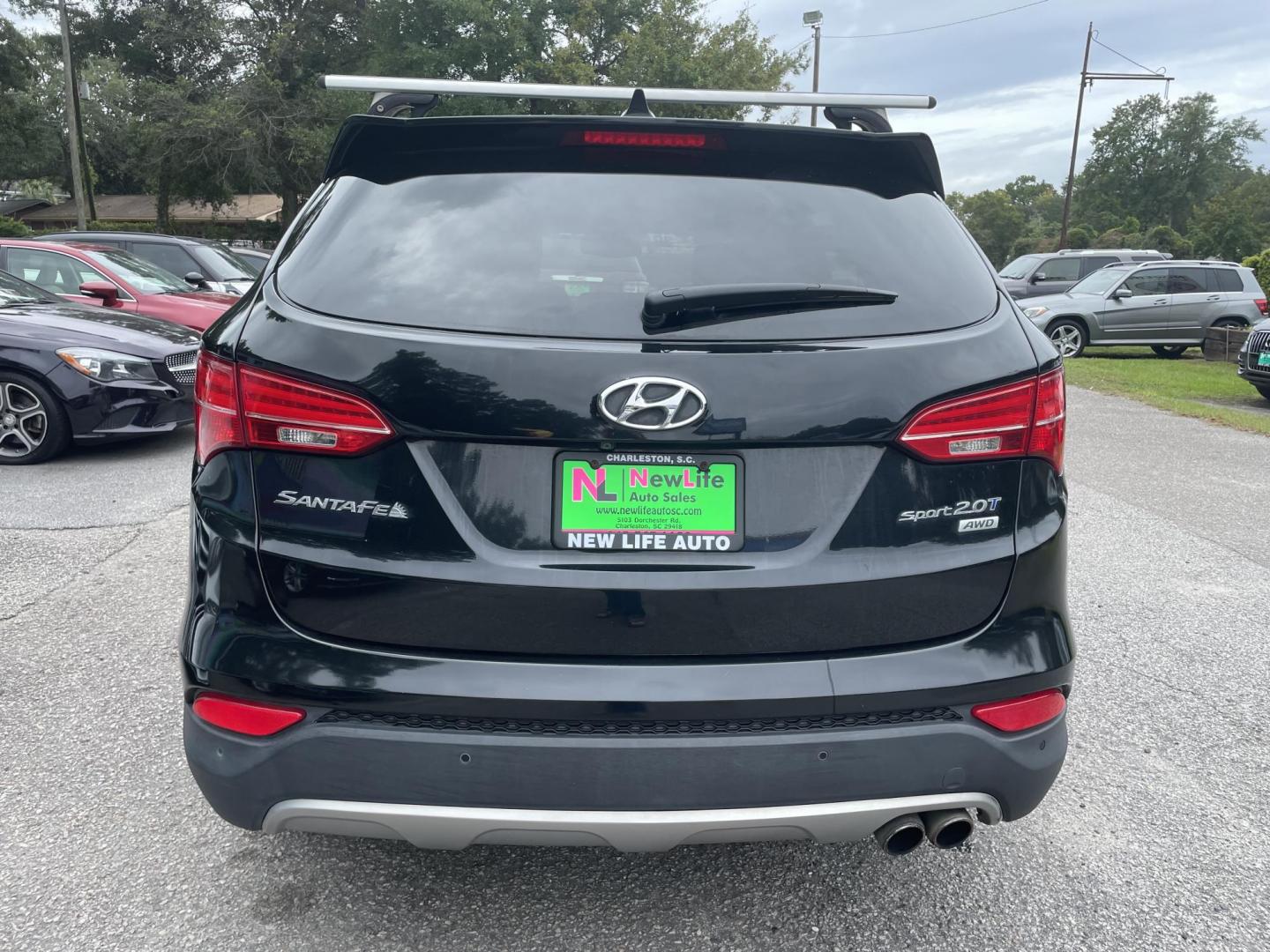 2014 BLACK HYUNDAI SANTA FE SPORT 2.0T (5XYZWDLA2EG) with an 2.0L engine, Automatic transmission, located at 5103 Dorchester Rd., Charleston, SC, 29418-5607, (843) 767-1122, 36.245171, -115.228050 - Beautiful Peanut Butter Leather Interior with Panoramic Sunroof, Navigation, Backup Camera, CD/AUX/Bluetooth, Dual Climate Control, Power Everything (windows, locks, seats, mirrors), Heated/Cooled/Memory Front Seats, Heated Rear Seats, Heated Steering Wheel, Push Button Start, Keyless Entry, Sport R - Photo#5