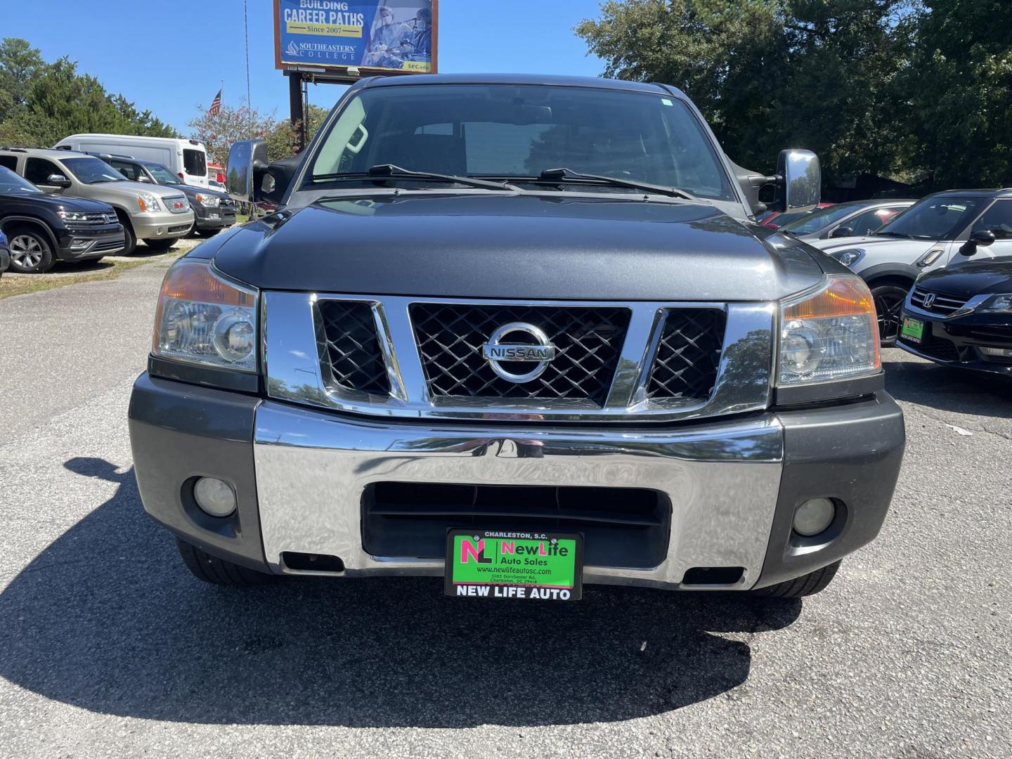 2012 GRAY NISSAN TITAN SV (1N6BA0ED8CN) with an 5.6L engine, Automatic transmission, located at 5103 Dorchester Rd., Charleston, SC, 29418-5607, (843) 767-1122, 36.245171, -115.228050 - Local Trade-in with Clean Interior, CD/AUX, Power Everything (windows, locks, seat, mirrors), Keyless Entry, Running Boards, Tow Package, Bed Liner, Alloy Wheels. Clean CarFax (no accidents reported!) 145k miles Located at New Life Auto Sales! 2023 WINNER for Post & Courier's Charleston's Choice Pr - Photo#1