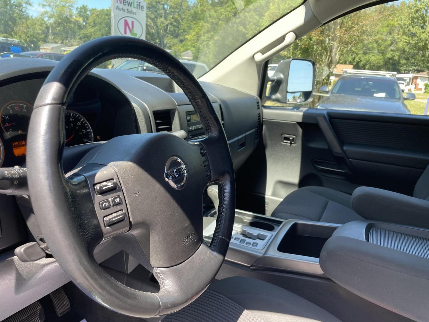 2012 GRAY NISSAN TITAN SV (1N6BA0ED8CN) with an 5.6L engine, Automatic transmission, located at 5103 Dorchester Rd., Charleston, SC, 29418-5607, (843) 767-1122, 36.245171, -115.228050 - Local Trade-in with Clean Interior, CD/AUX, Power Everything (windows, locks, seat, mirrors), Keyless Entry, Running Boards, Tow Package, Bed Liner, Alloy Wheels. Clean CarFax (no accidents reported!) 145k miles Located at New Life Auto Sales! 2023 WINNER for Post & Courier's Charleston's Choice Pr - Photo#17