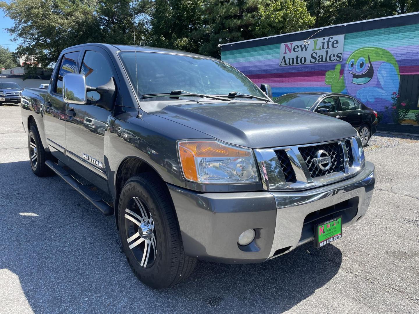 2012 GRAY NISSAN TITAN SV (1N6BA0ED8CN) with an 5.6L engine, Automatic transmission, located at 5103 Dorchester Rd., Charleston, SC, 29418-5607, (843) 767-1122, 36.245171, -115.228050 - Local Trade-in with Clean Interior, CD/AUX, Power Everything (windows, locks, seat, mirrors), Keyless Entry, Running Boards, Tow Package, Bed Liner, Alloy Wheels. Clean CarFax (no accidents reported!) 145k miles Located at New Life Auto Sales! 2023 WINNER for Post & Courier's Charleston's Choice Pr - Photo#0