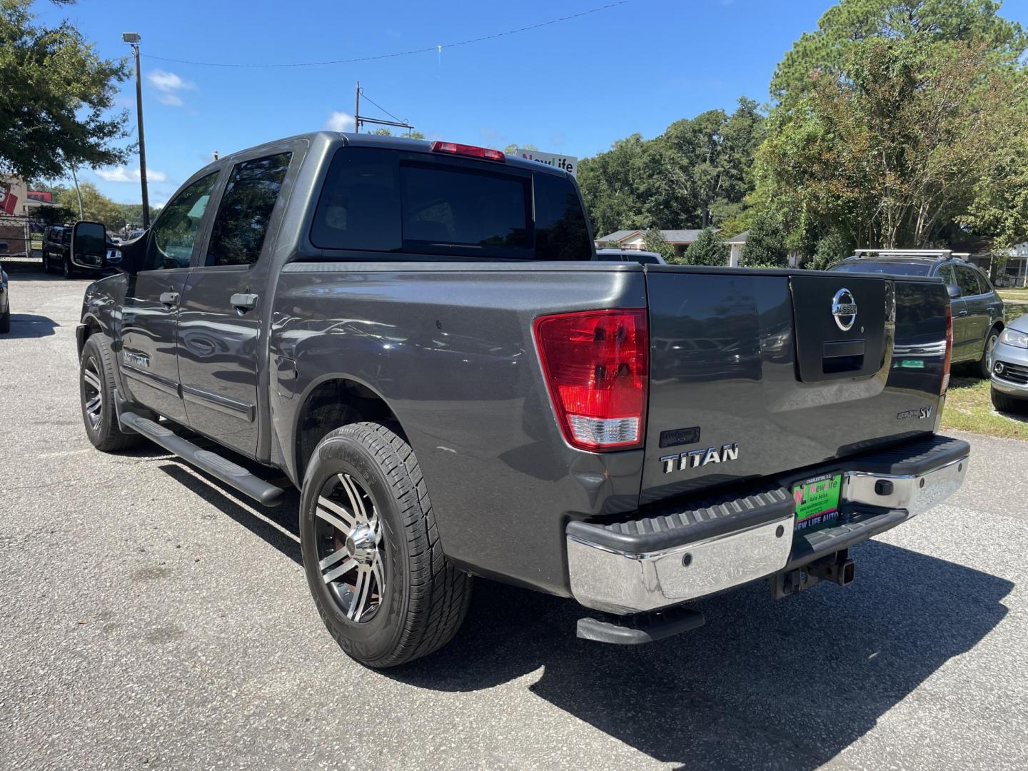 2012 GRAY NISSAN TITAN SV (1N6BA0ED8CN) with an 5.6L engine, Automatic transmission, located at 5103 Dorchester Rd., Charleston, SC, 29418-5607, (843) 767-1122, 36.245171, -115.228050 - Local Trade-in with Clean Interior, CD/AUX, Power Everything (windows, locks, seat, mirrors), Keyless Entry, Running Boards, Tow Package, Bed Liner, Alloy Wheels. Clean CarFax (no accidents reported!) 145k miles Located at New Life Auto Sales! 2023 WINNER for Post & Courier's Charleston's Choice Pr - Photo#4