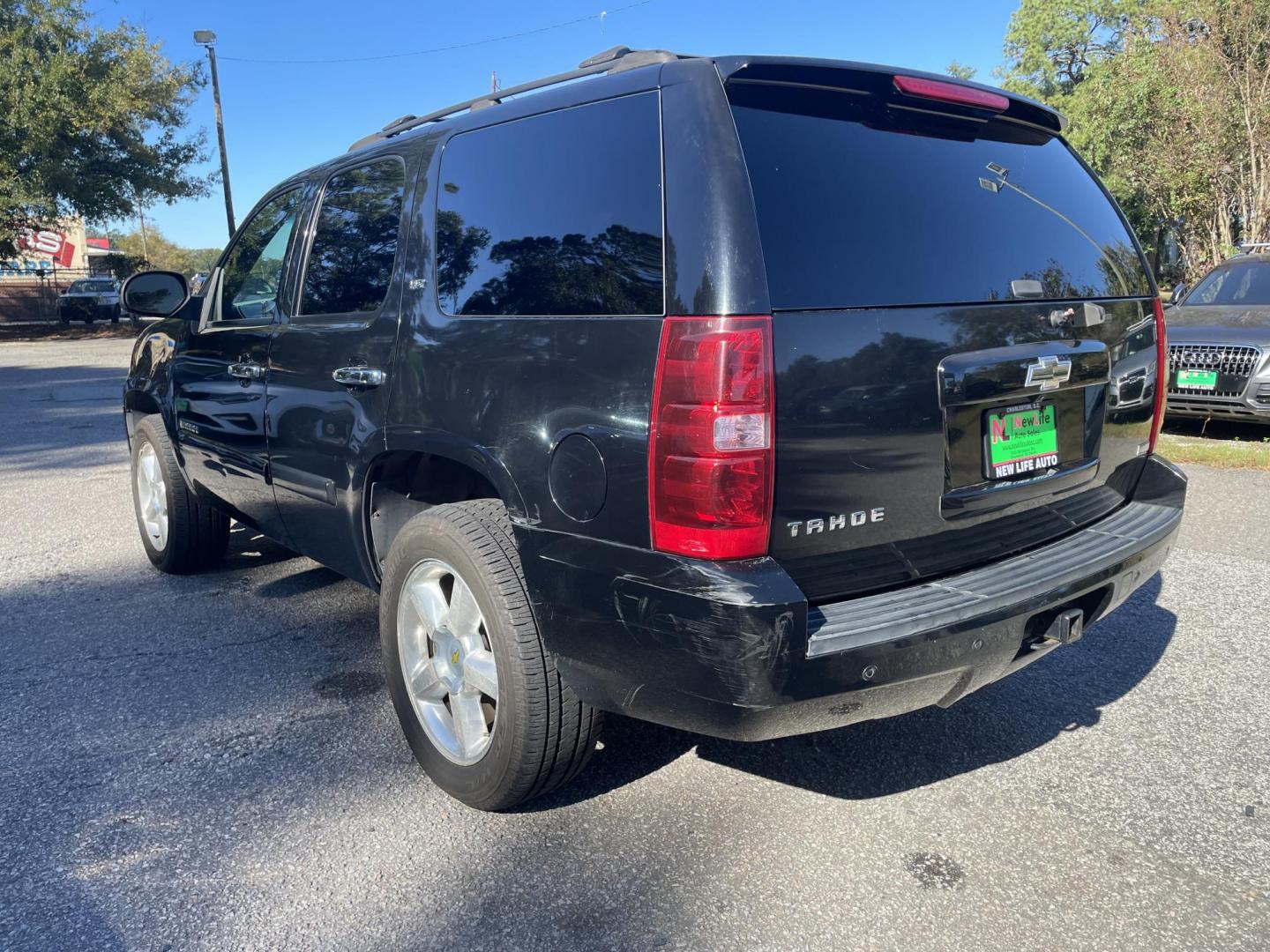 2007 BLACK CHEVROLET TAHOE LTZ (1GNFK13057R) with an 5.3L engine, Automatic transmission, located at 5103 Dorchester Rd., Charleston, SC, 29418-5607, (843) 767-1122, 36.245171, -115.228050 - Leather, Sunroof, Navigation, Backup Camera, CD/Aux/Sat, OnStar, Dual Climate Control, Power Everything (windows, locks, seats, mirrors), Heated/Memory Seating, Power Liftgate, Keyless Entry, Middle Row Captain's Seats, Convenient Third Row, Alloy Wheels. 226k miles Located at New Life Auto Sales! - Photo#5