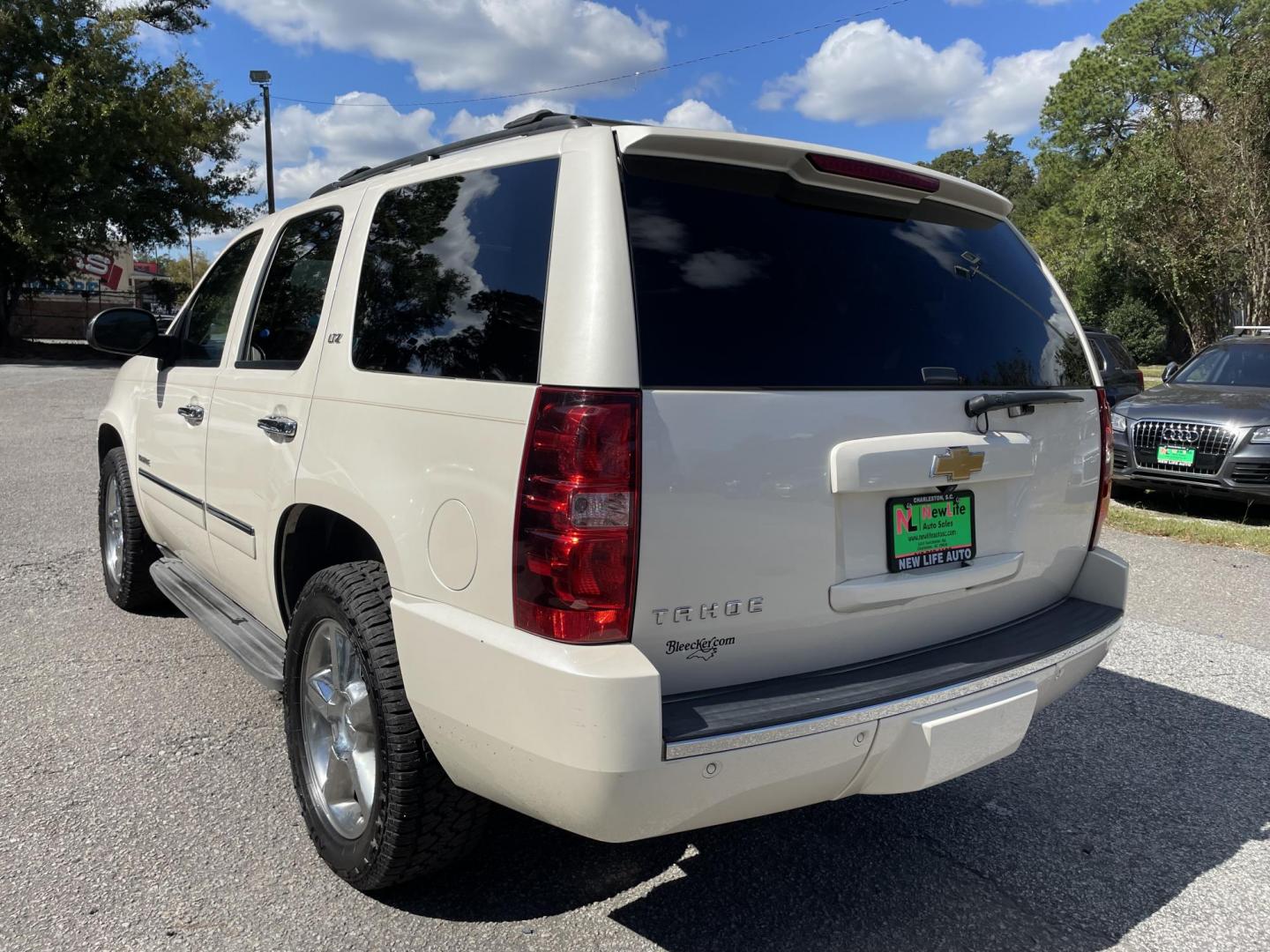 2014 WHITE CHEVROLET TAHOE LTZ (1GNSCCE09ER) with an 5.3L engine, Automatic transmission, located at 5103 Dorchester Rd., Charleston, SC, 29418-5607, (843) 767-1122, 36.245171, -115.228050 - Leather, Sunroof, Navigation, Backup Camera, Rear DVD, Dual Climate Control, Power Everything (windows, locks, seats, mirrors), Heated/Cooled/ Memory Seating, Rear Heated Seats, Power Liftgate, Keyless Entry, Middle Row Captain's Seats, Convenient Third Row, Running Boards, Tow Package, Alloy Wheel - Photo#3