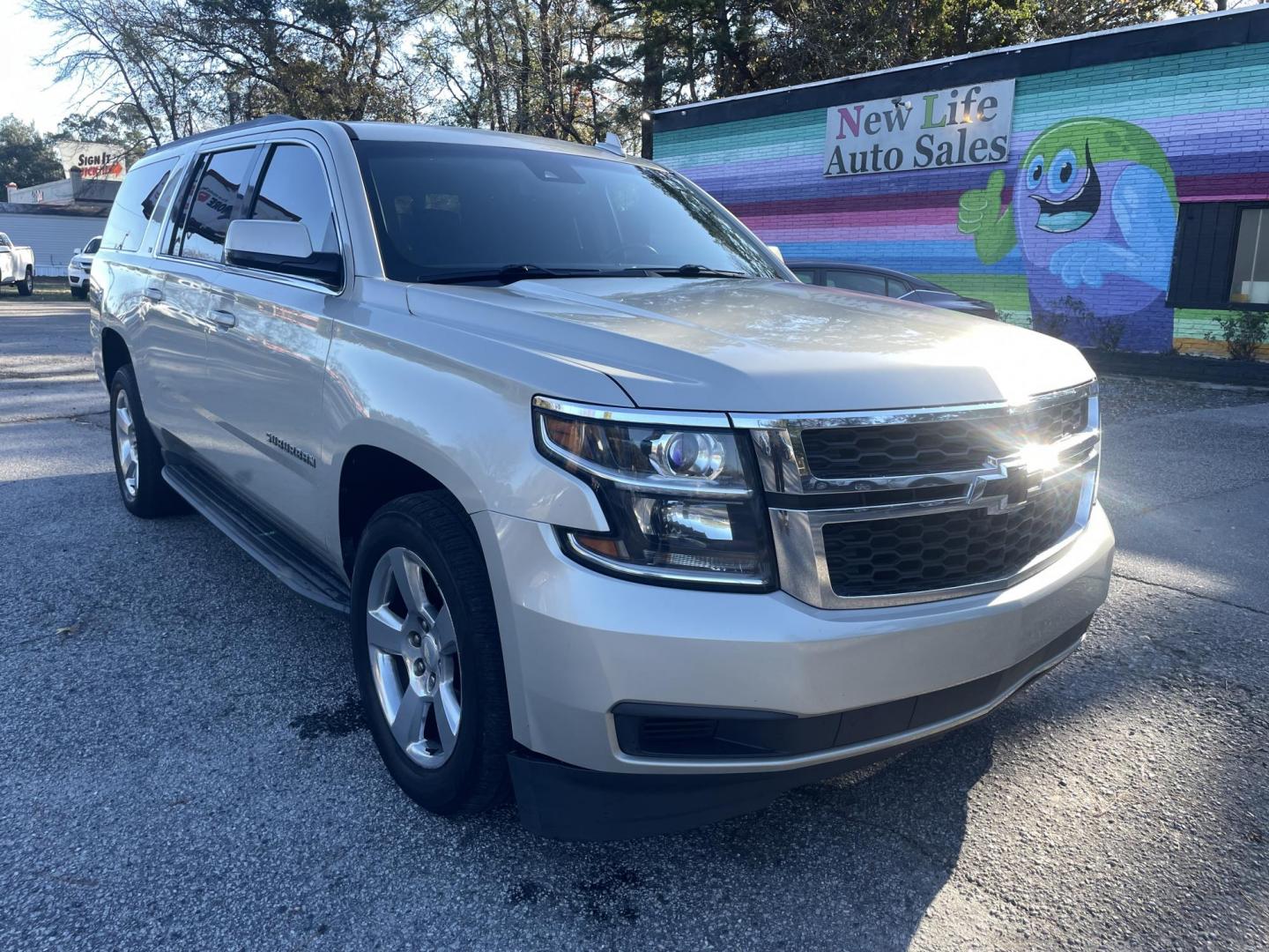 2016 GOLD CHEVROLET SUBURBAN LT (1GNSCHKC8GR) with an 5.3L engine, Automatic transmission, located at 5103 Dorchester Rd., Charleston, SC, 29418-5607, (843) 767-1122, 36.245171, -115.228050 - Clean & Spacious, Leather, Sunroof, OnStar Navigation, SAT/AUX/Bluetooth, Backup Camera, Dual Climate Control, Power Everything (windows, locks, seats, mirrors), Heated/Memory Seating, Rear Climate Control, Third Row, Spacious Cargo, Power Liftgate, Keyless Entry, Running Boards, Tow Package, Alloy - Photo#0