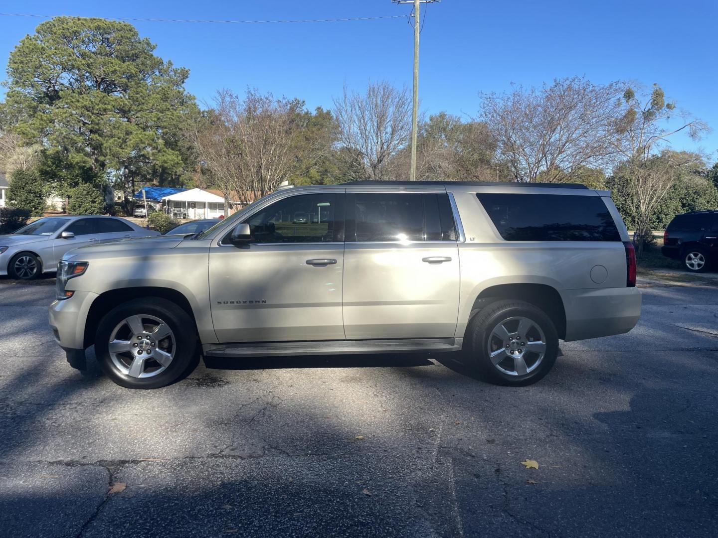 2016 GOLD CHEVROLET SUBURBAN LT (1GNSCHKC8GR) with an 5.3L engine, Automatic transmission, located at 5103 Dorchester Rd., Charleston, SC, 29418-5607, (843) 767-1122, 36.245171, -115.228050 - Clean & Spacious, Leather, Sunroof, OnStar Navigation, SAT/AUX/Bluetooth, Backup Camera, Dual Climate Control, Power Everything (windows, locks, seats, mirrors), Heated/Memory Seating, Rear Climate Control, Third Row, Spacious Cargo, Power Liftgate, Keyless Entry, Running Boards, Tow Package, Alloy - Photo#4