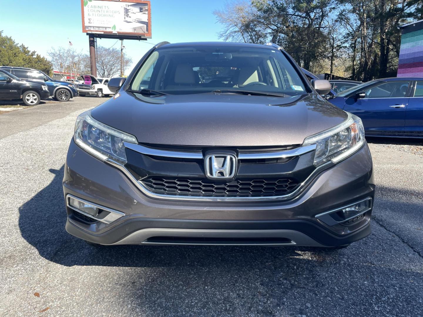 2015 BROWN HONDA CR-V EX-L (2HKRM4H70FH) with an 2.4L engine, Continuously Variable transmission, located at 5103 Dorchester Rd., Charleston, SC, 29418-5607, (843) 767-1122, 36.245171, -115.228050 - Photo#1