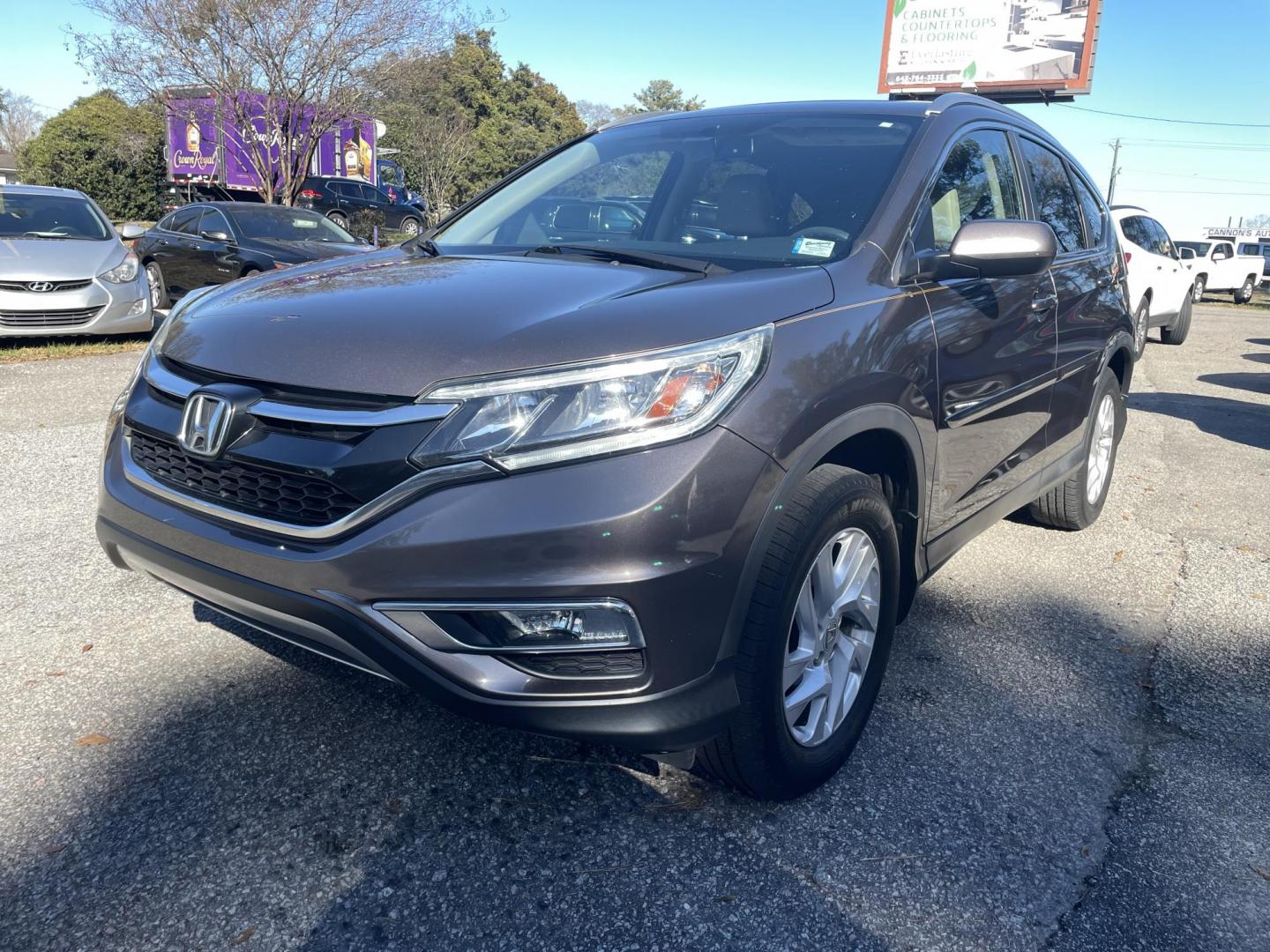 2015 BROWN HONDA CR-V EX-L (2HKRM4H70FH) with an 2.4L engine, Continuously Variable transmission, located at 5103 Dorchester Rd., Charleston, SC, 29418-5607, (843) 767-1122, 36.245171, -115.228050 - Local Trade-in with Leather, Sunroof, Navigation, Backup Camera, AUX/USB/Sat/Bluetooth, Dual Climate Control, Power Everything (windows, locks, seat, mirrors), Heated Seats, Push Button Start, Keyless Entry, Alloy Wheels. 144k miles Located at New Life Auto Sales! 2023 WINNER for Post & Courier's C - Photo#2